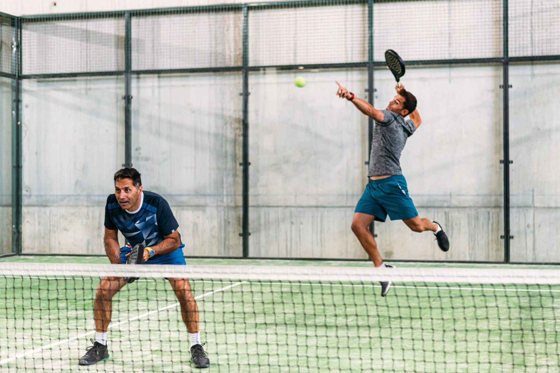 padel players on a court